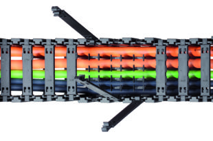 Protecting moving cables and hoses in extreme environments